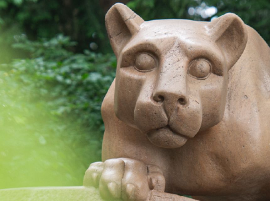 Lion shrine against greenery.